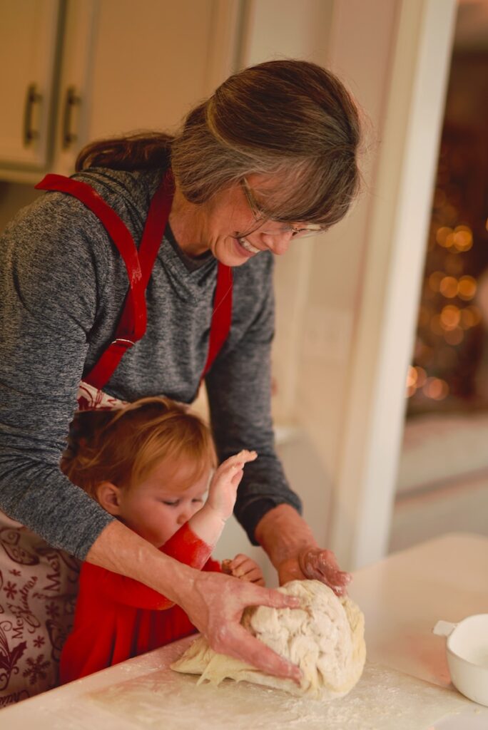 Grandma and child baking together